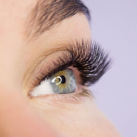 a woman with long, full lash extensions