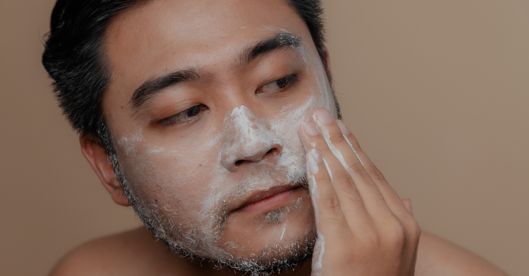 man washing face
