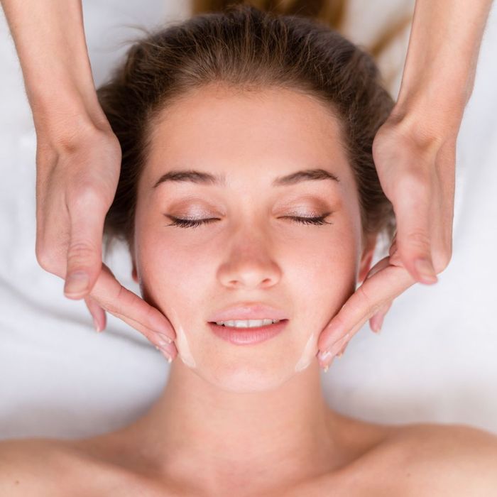 Person receiving a facial massage