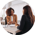 A woman speaking with a home builder