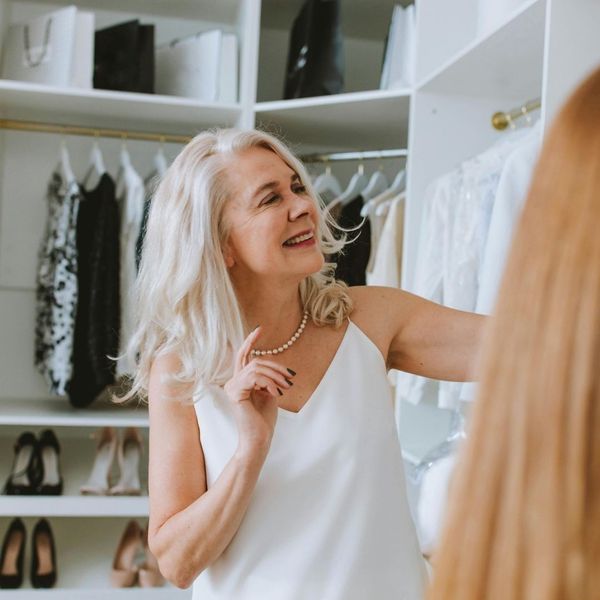 woman getting ready in a walk-in closet