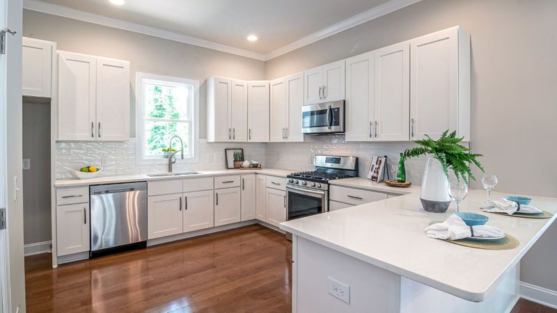 a neutral kitchen with white cabinets