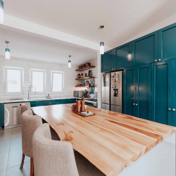 kitchen with blue cabinets and accents