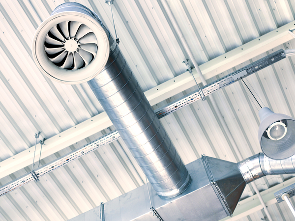Ventilators on the roof of a tall building in an industrial area. Ventilators on the roof of a tall building in an industrial area.