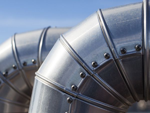 Close-up of two ducts at industrial system ventilation. Close-up of two ducts at industrial system ventilation.