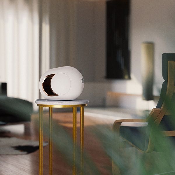 A home speaker on a table in a living room