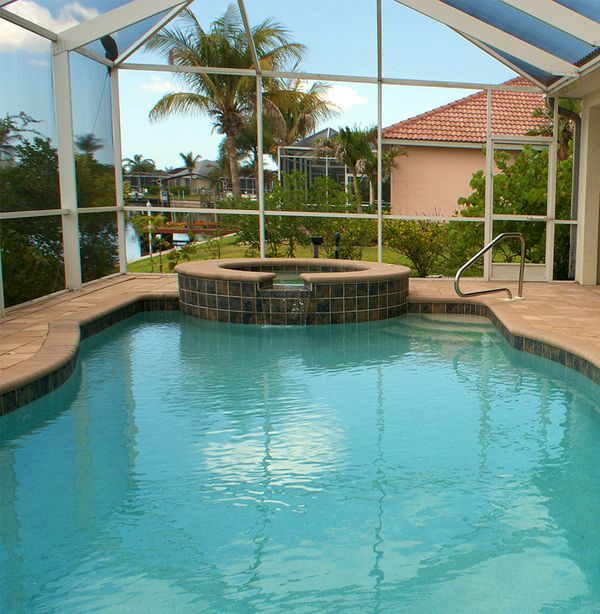 Enclosure over pool in backyard