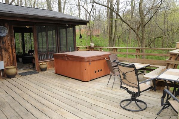 Enclosed patio that leads to a back porch