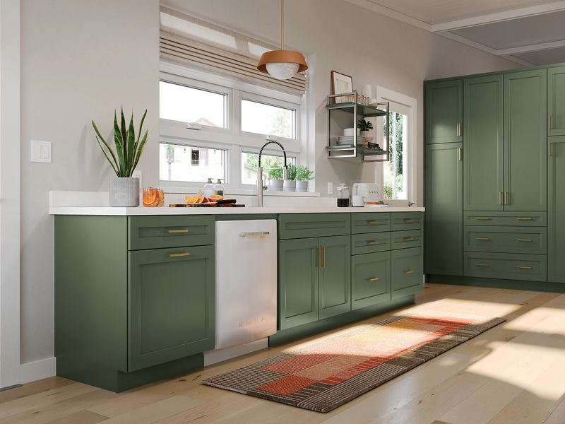 green cabinets in modern kitchen