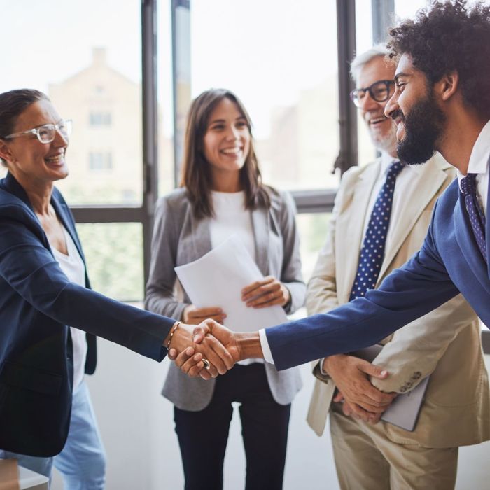 Business meeting handshake standing up