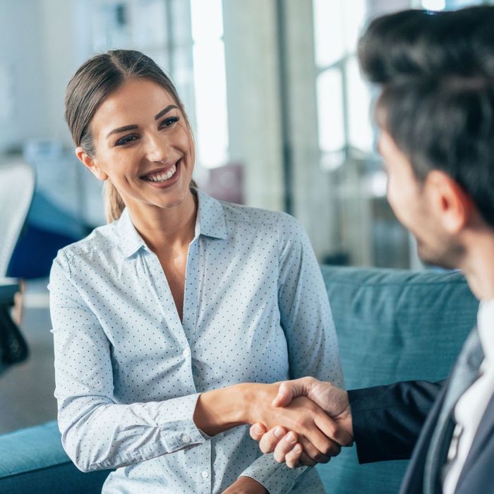 Business handshake between a man and woman