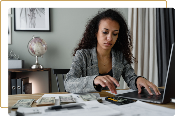 image of a woman doing taxes
