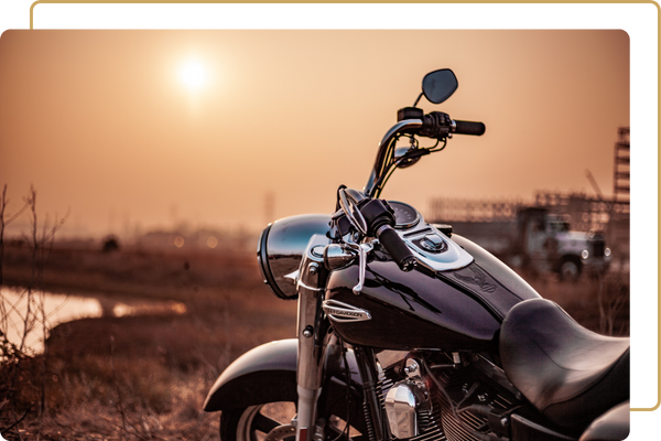 close up of motorcycle at sunset