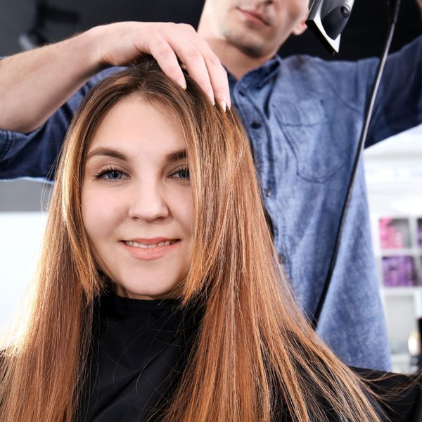 woman receiving Brazilian blowout at salon