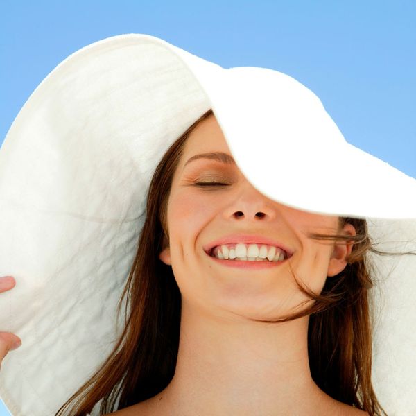Woman wearing large sun hat
