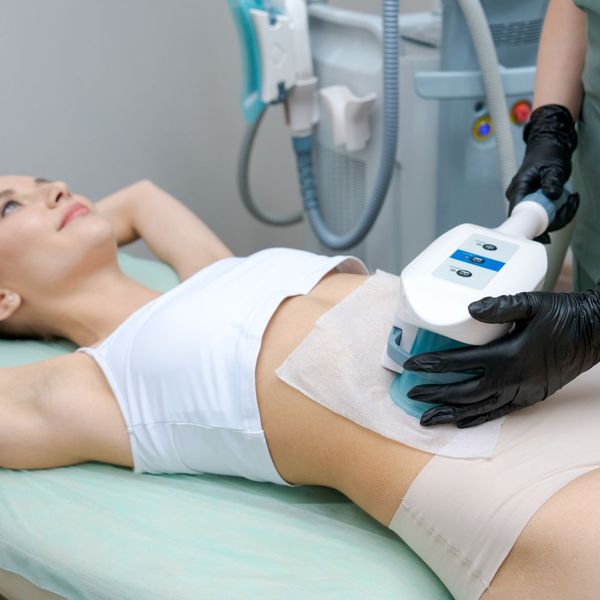 woman having CoolSculpting done on her stomach