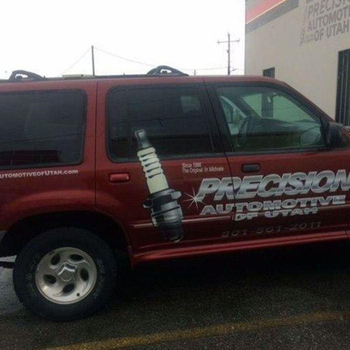 Red SUV with graphics of a car part