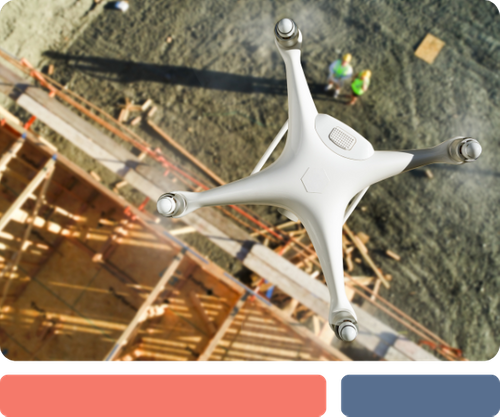 overhead view of a drone flying over a home under construction with framing in place