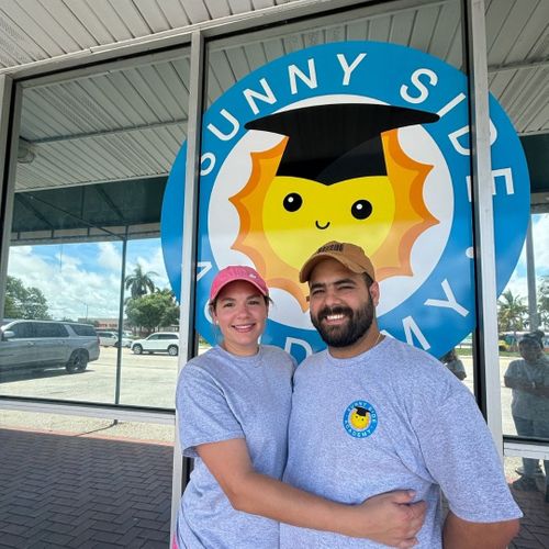owners of Sunny Side in front of school
