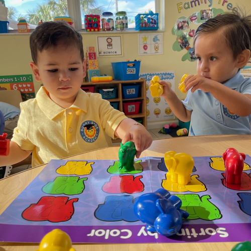 Children playing with toy animals