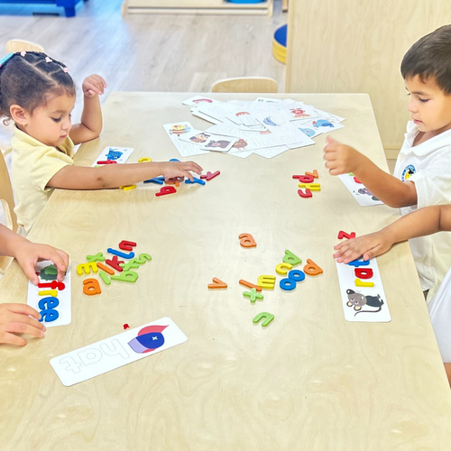 Children playing with letters