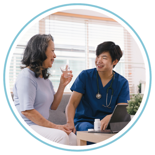 nurse helping client take medicine 