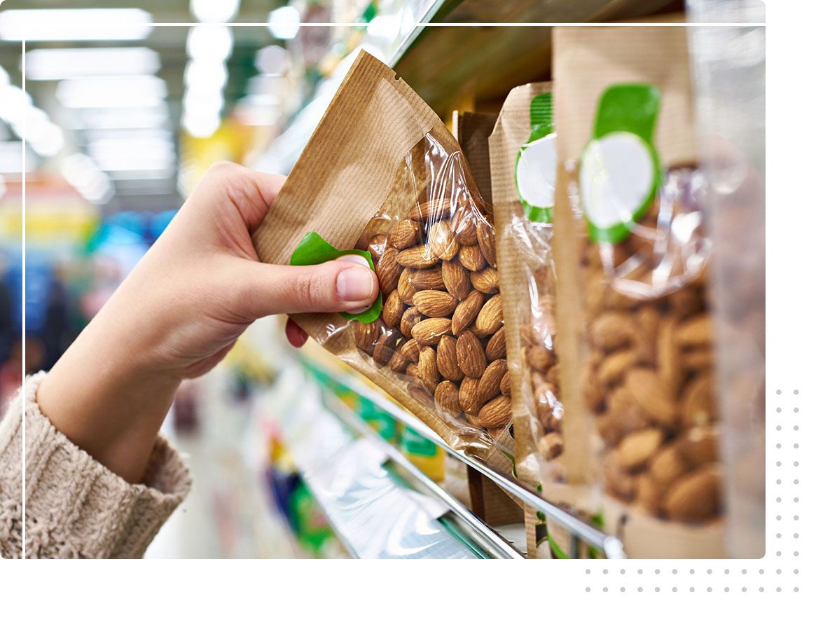 hand grabbing bag of nuts