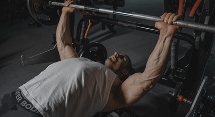 man doing benchpress. 