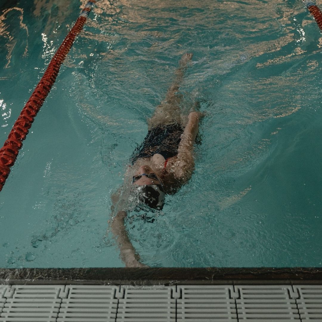 person swimming laps in a pool. 