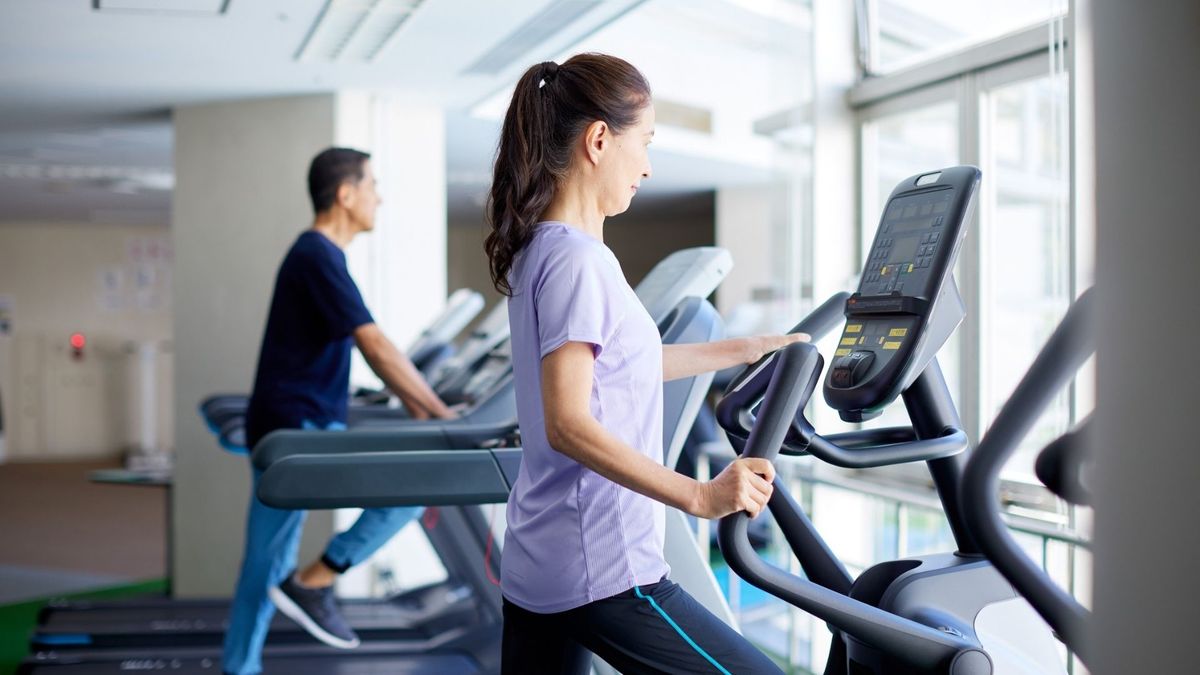 people walking on treadmills. 