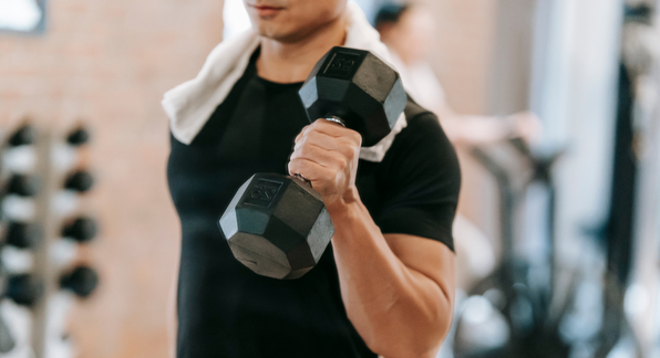 man lifting weights. 