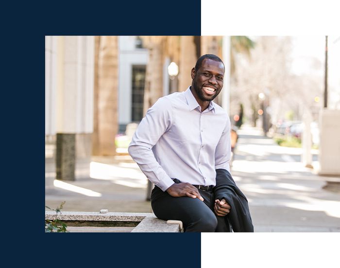 Person smiling and sitting outside