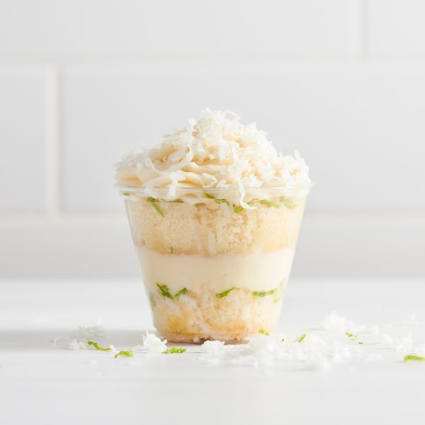 Key lime pie dessert in a cup with coconut 