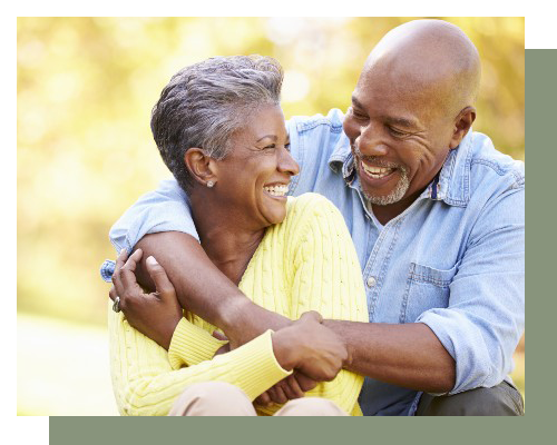 Elderly couple looking at each other and smiling