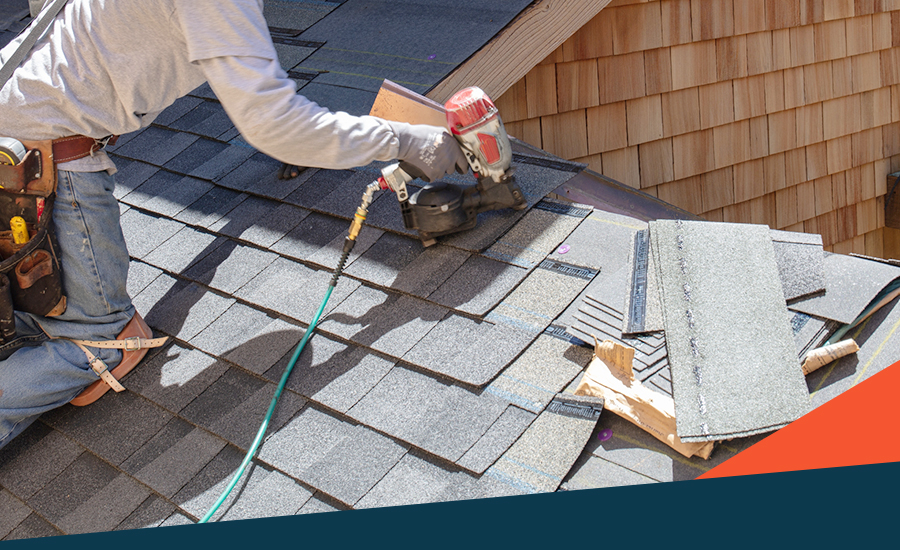 image of a man installing shingles