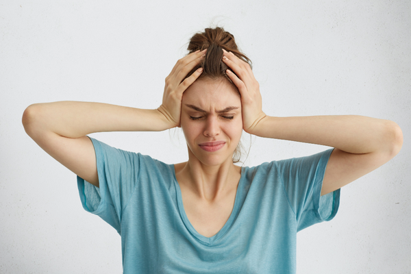 image of a woman with a headache