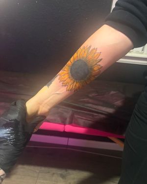 A tattoo of a sun flower