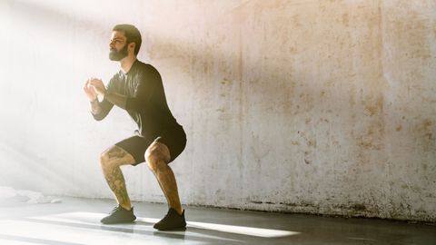 man doing squats 