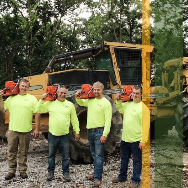 Workers posing with chainsaws About.jpg