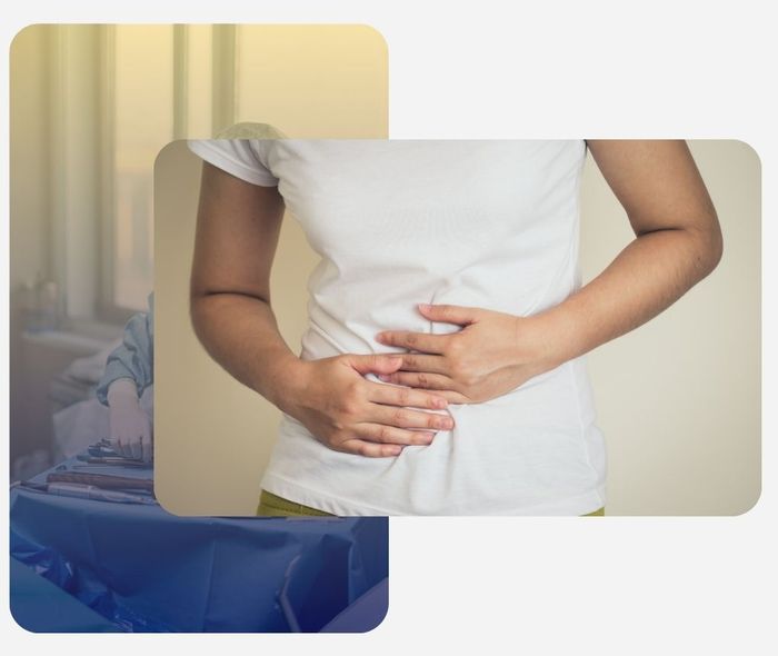 woman holding stomach while experiencing pain woman holding stomach while experiencing pain