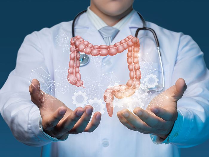 doctor with graphic of digestive tract