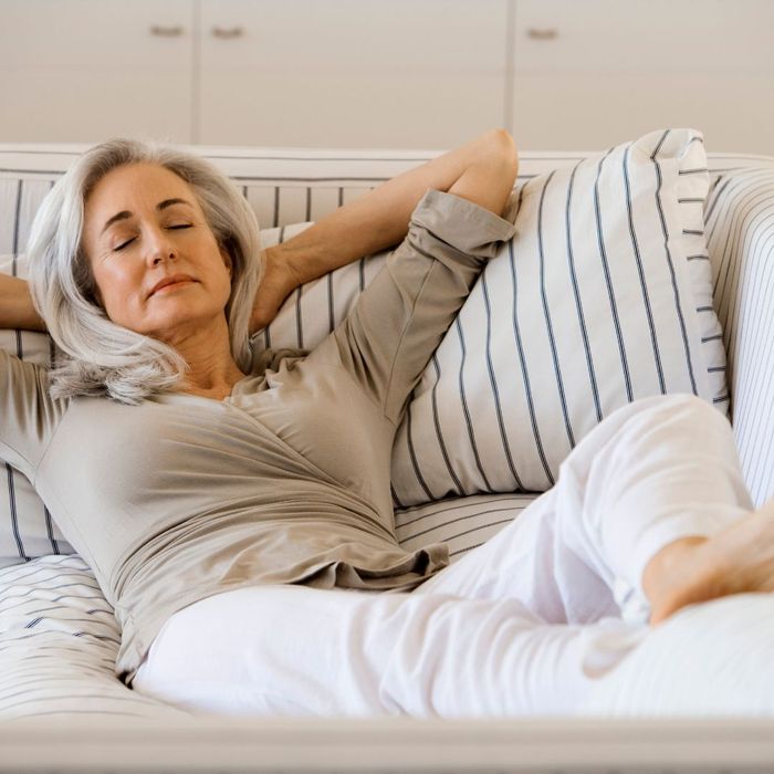 Older woman relaxing on couch