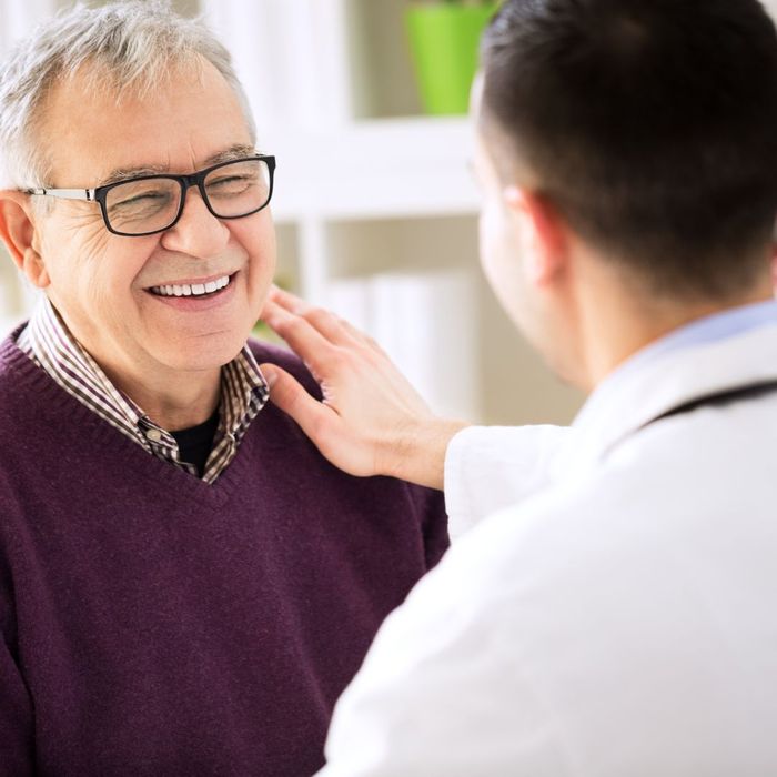 older man talking with doctor