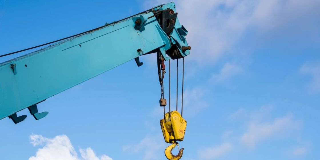 construction machine with hook on the end