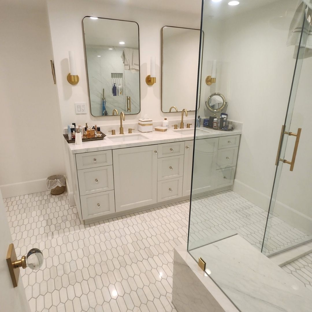 Bathroom with white walls, tile floors, and granite countertop