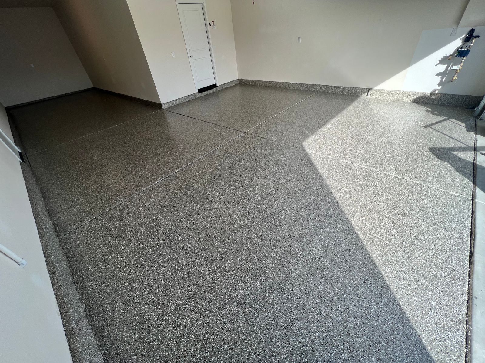 Garage Floor with Creekbed Flake System by Warrior Epoxy