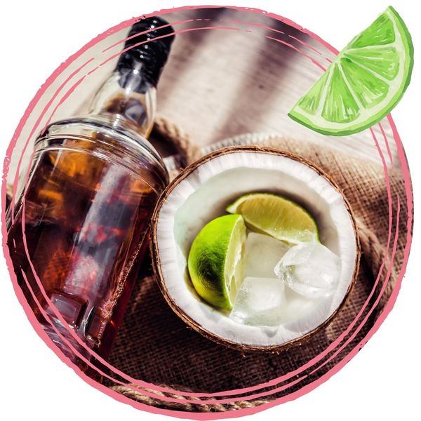 coconut and lime next to bottle of rum