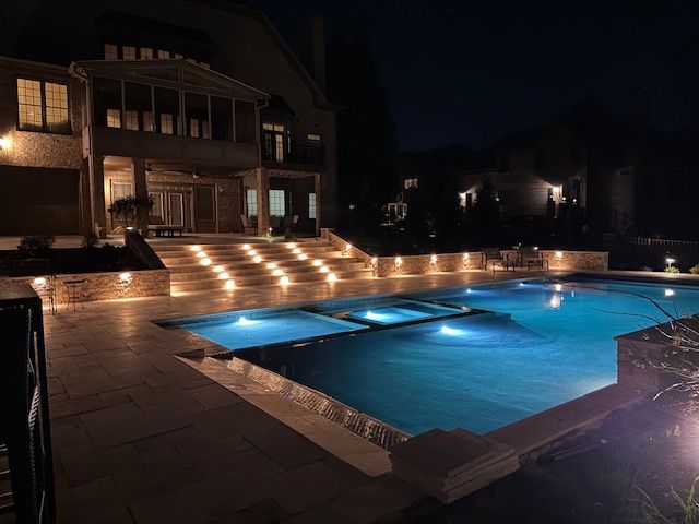 custom poolscape at night
