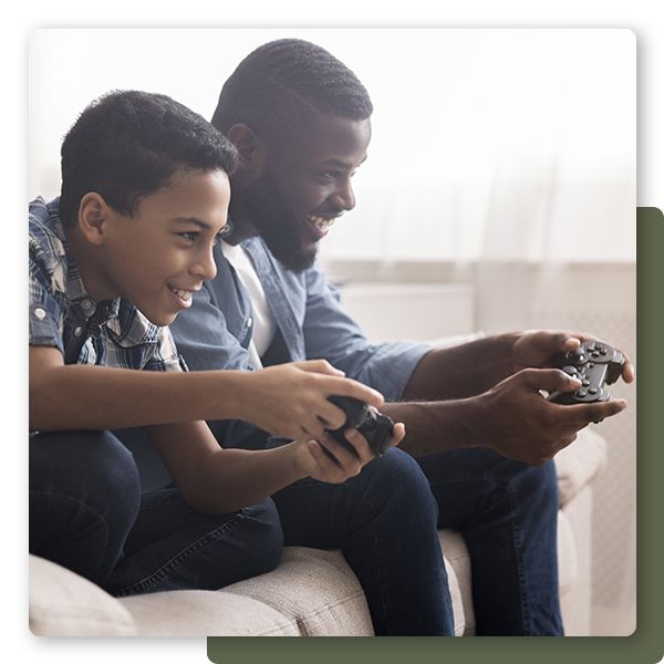 Father playing video games with his son