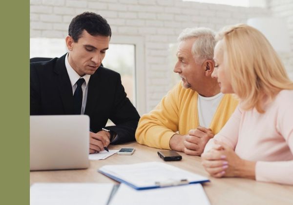 lawyer consulting with older couple